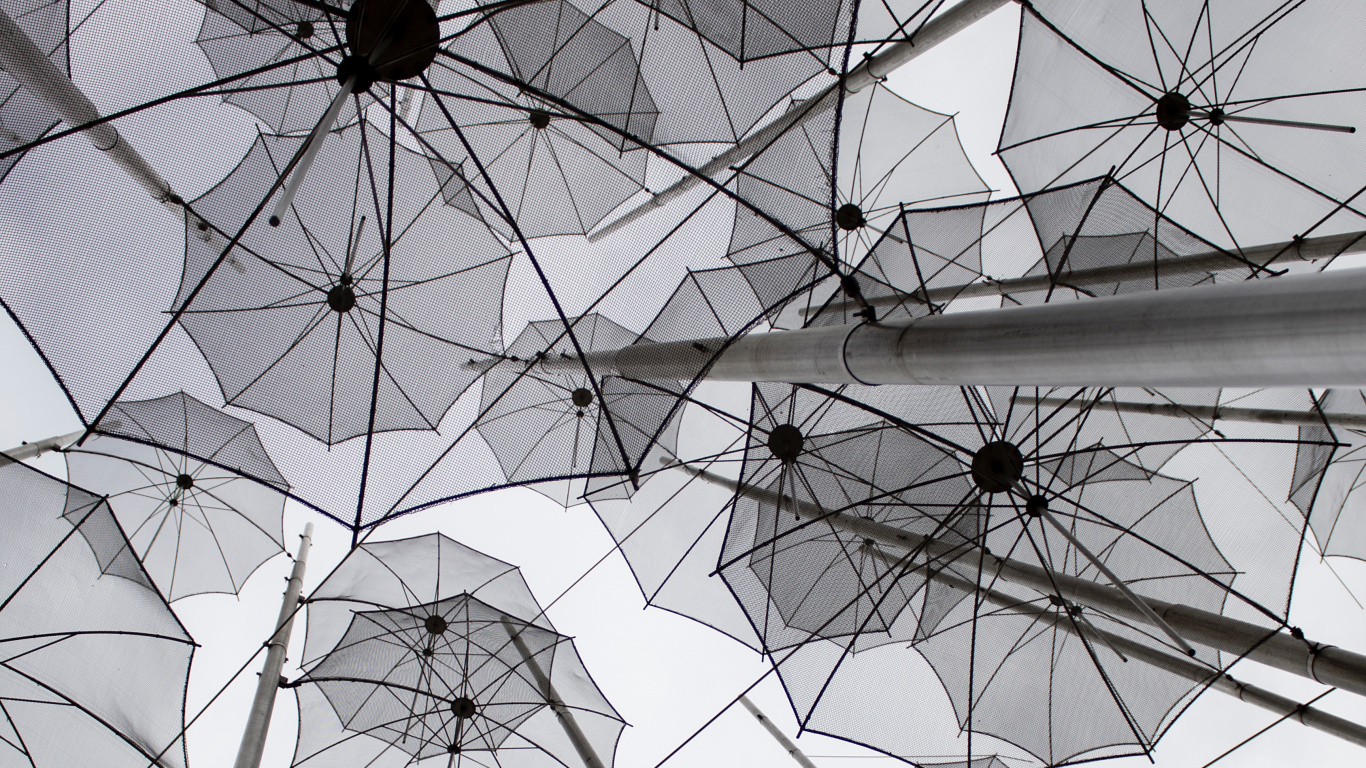 White Umbrellas on Gray Metal Frame. Wallpaper in 1366x768 Resolution