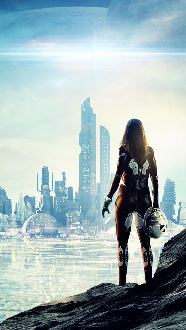 Woman in Black Tank Top and Black Shorts Standing on Rock Formation Near Body of Water. Wallpaper in 720x1280 Resolution