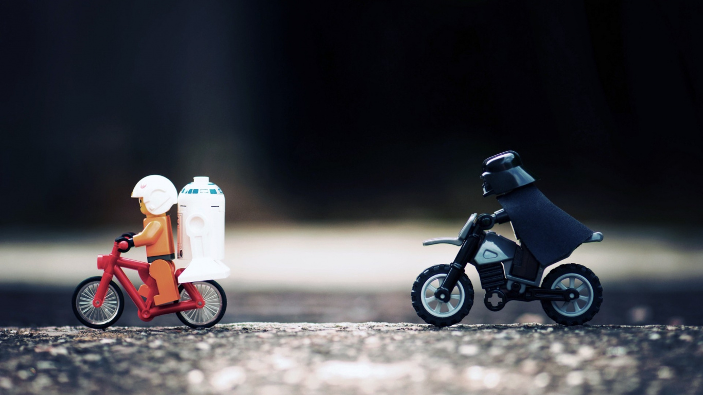 Black Motorcycle With Orange and White Plastic Toy. Wallpaper in 1366x768 Resolution