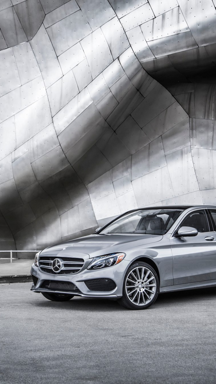 Silver Sedan on Gray Asphalt Road During Daytime. Wallpaper in 750x1334 Resolution