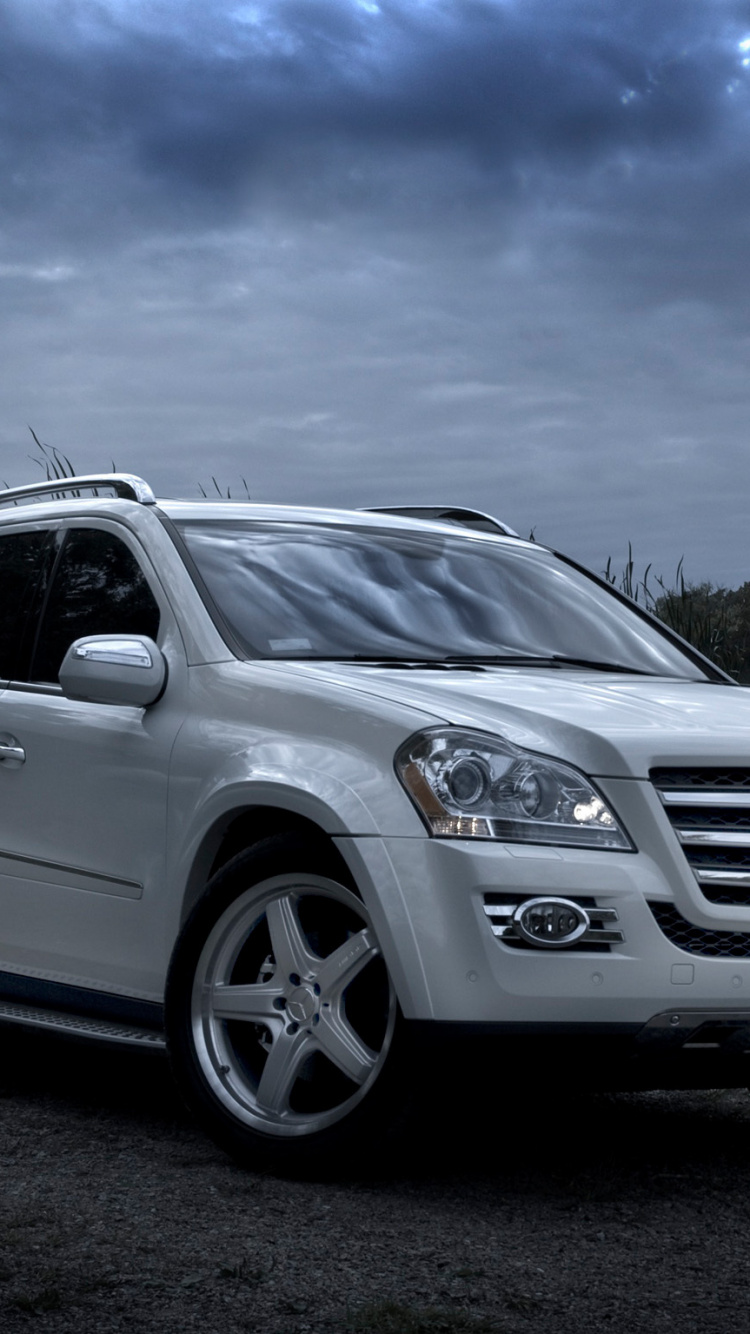 White Mercedes Benz Suv on Gray Sand During Daytime. Wallpaper in 750x1334 Resolution