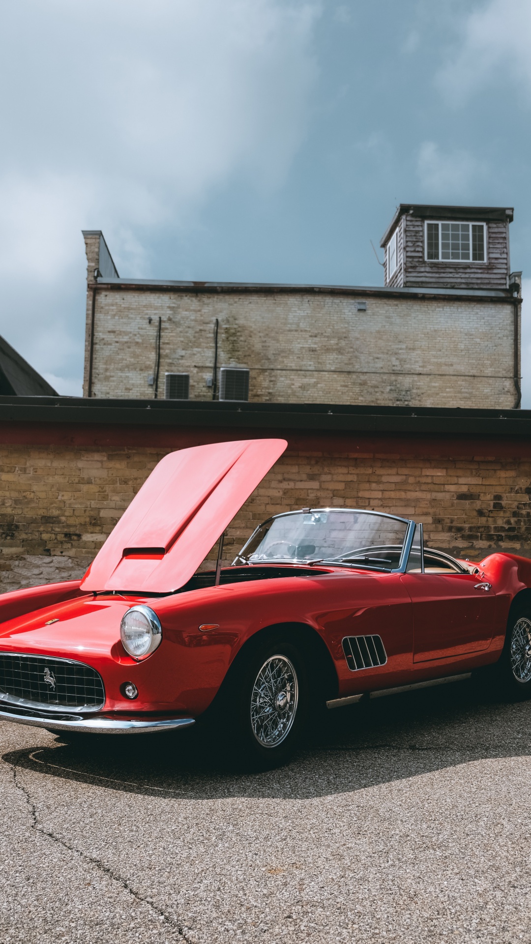 Ferrari 458 Italia Rojo Estacionado Cerca Del Edificio Marrón. Wallpaper in 1080x1920 Resolution