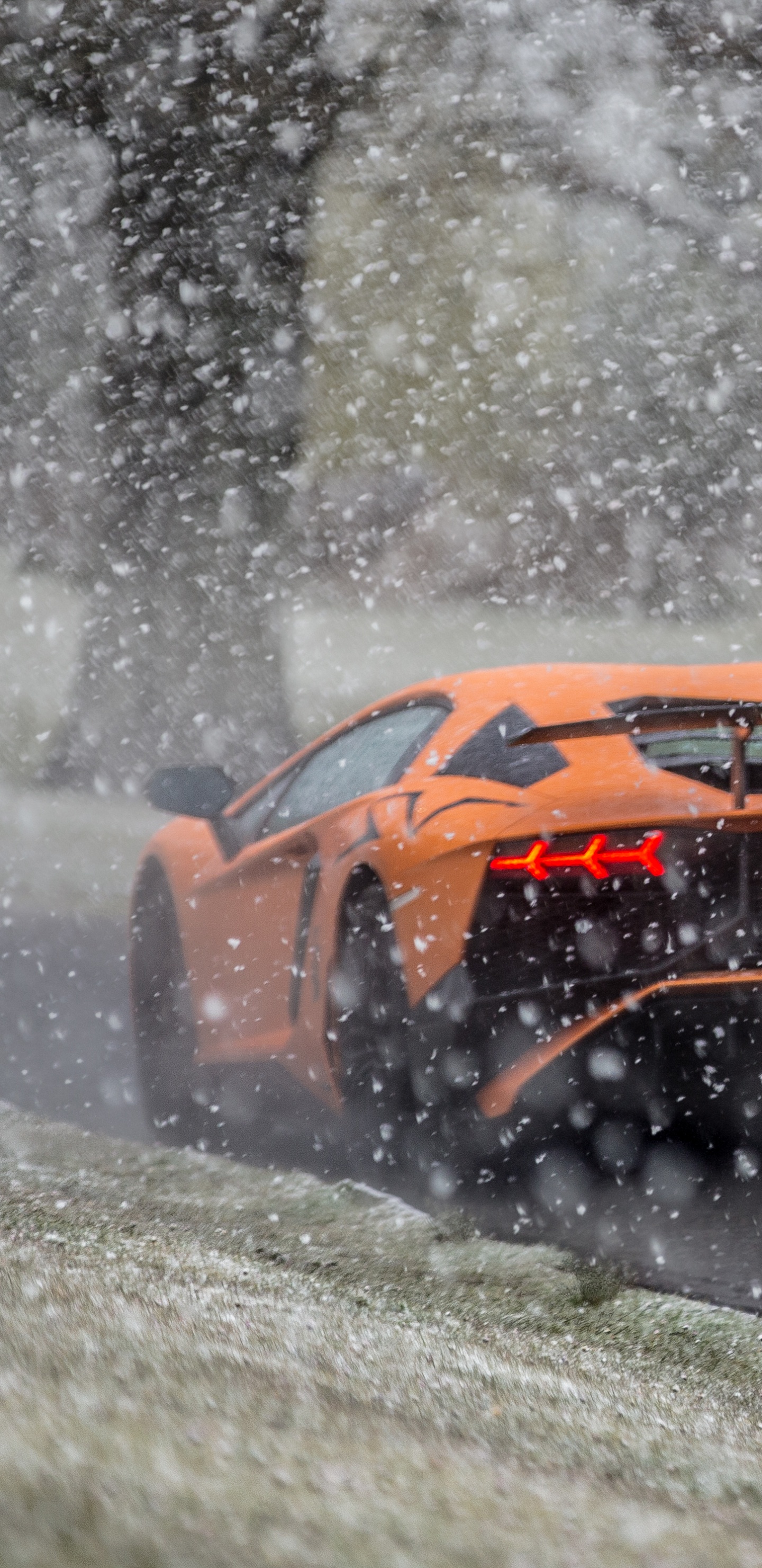 Yellow and Black Sports Car on Snow Covered Ground. Wallpaper in 1440x2960 Resolution