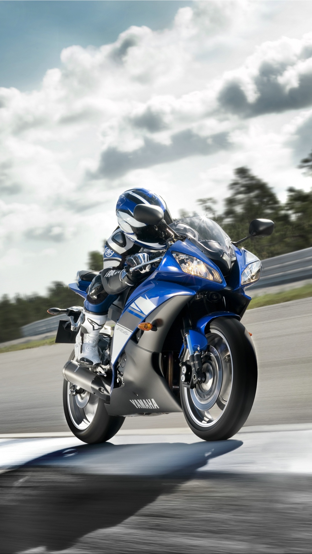 Man in Blue and White Jacket Riding Blue and White Sports Bike. Wallpaper in 1080x1920 Resolution