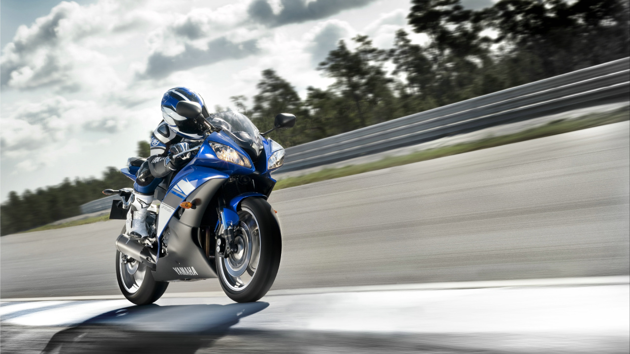 Man in Blue and White Jacket Riding Blue and White Sports Bike. Wallpaper in 1280x720 Resolution