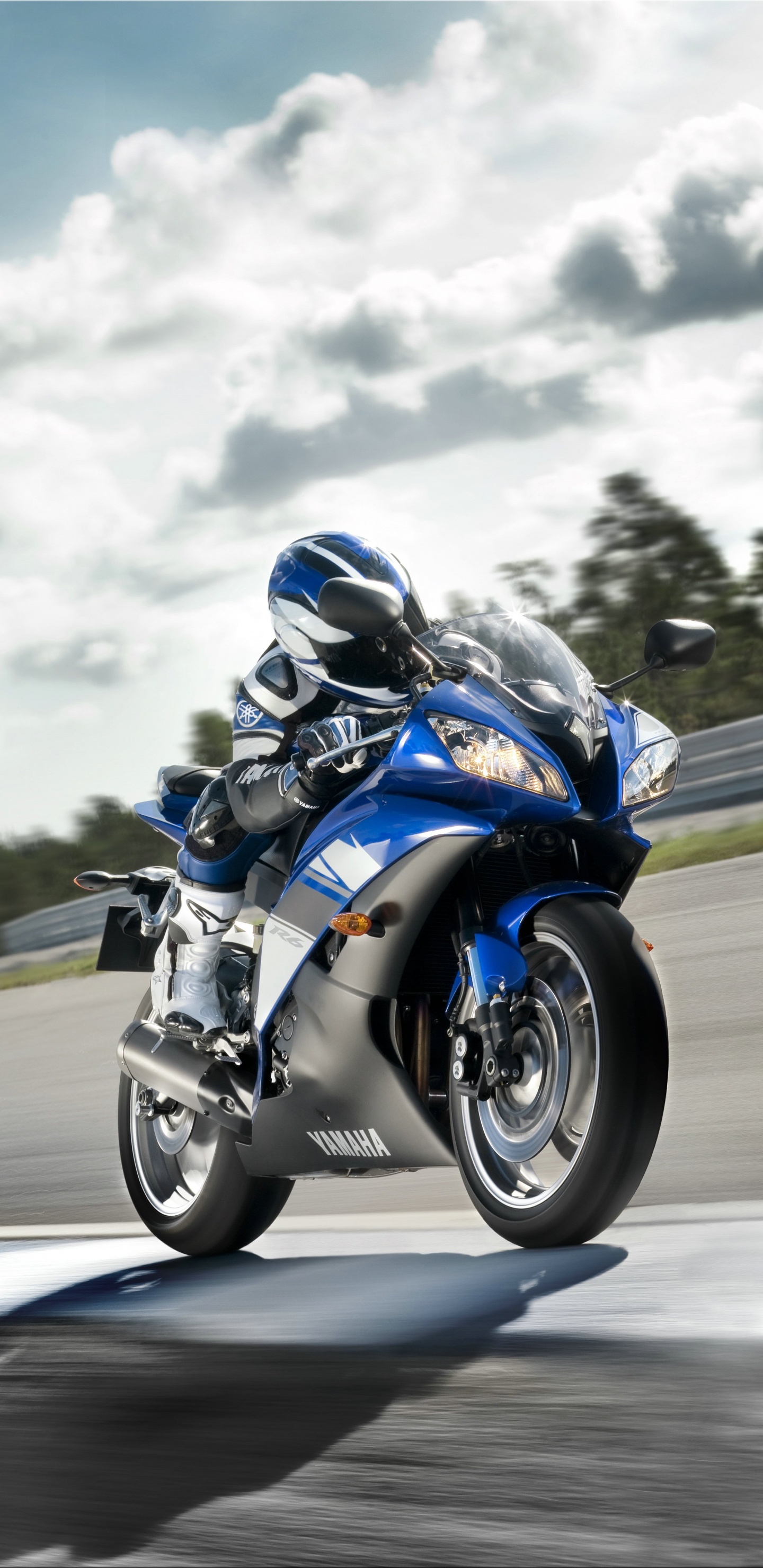 Man in Blue and White Jacket Riding Blue and White Sports Bike. Wallpaper in 1440x2960 Resolution