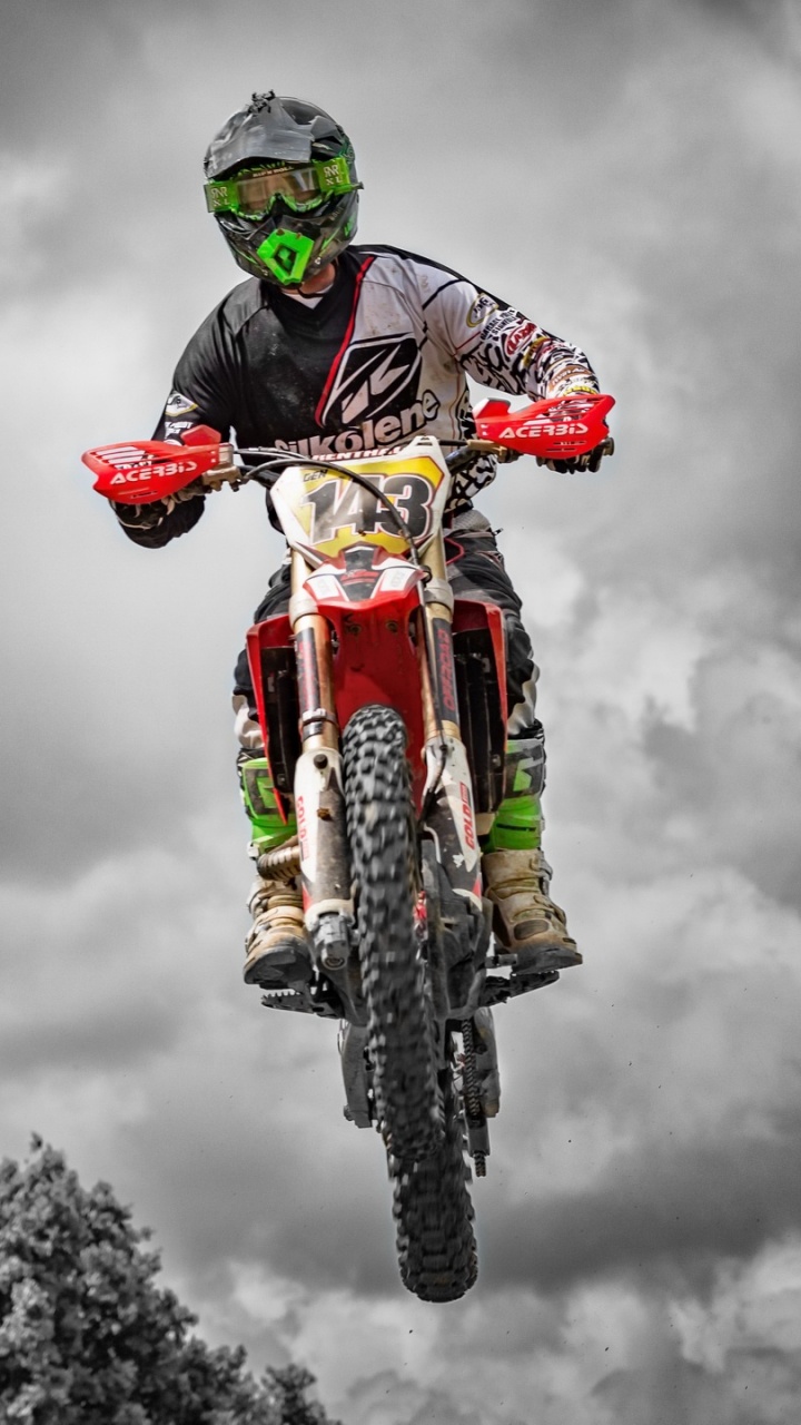 Man in Red and Black Motocross Suit Riding Motocross Dirt Bike. Wallpaper in 720x1280 Resolution
