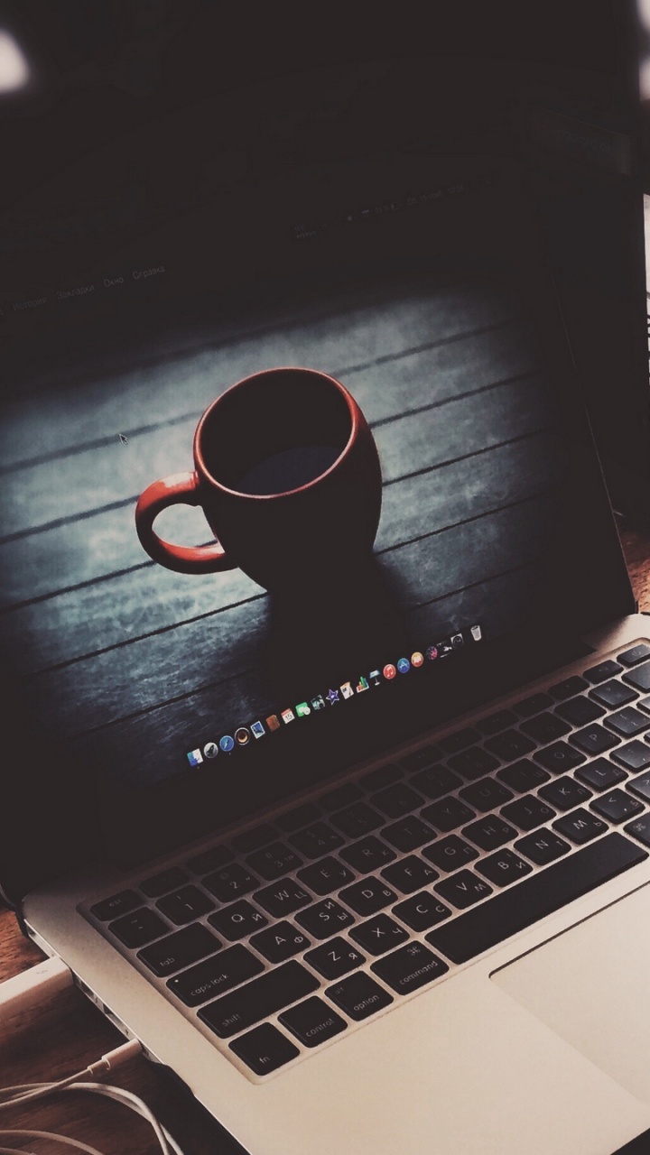 Black and Red Corded Headphones on Macbook Pro. Wallpaper in 720x1280 Resolution