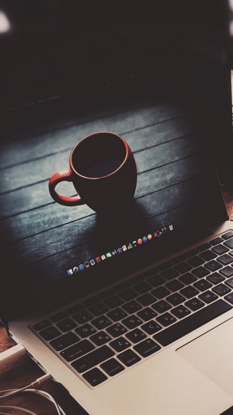 Black and Red Corded Headphones on Macbook Pro. Wallpaper in 750x1334 Resolution