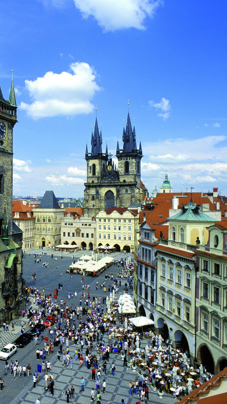 People Walking on Street Near Brown Concrete Building During Daytime. Wallpaper in 750x1334 Resolution