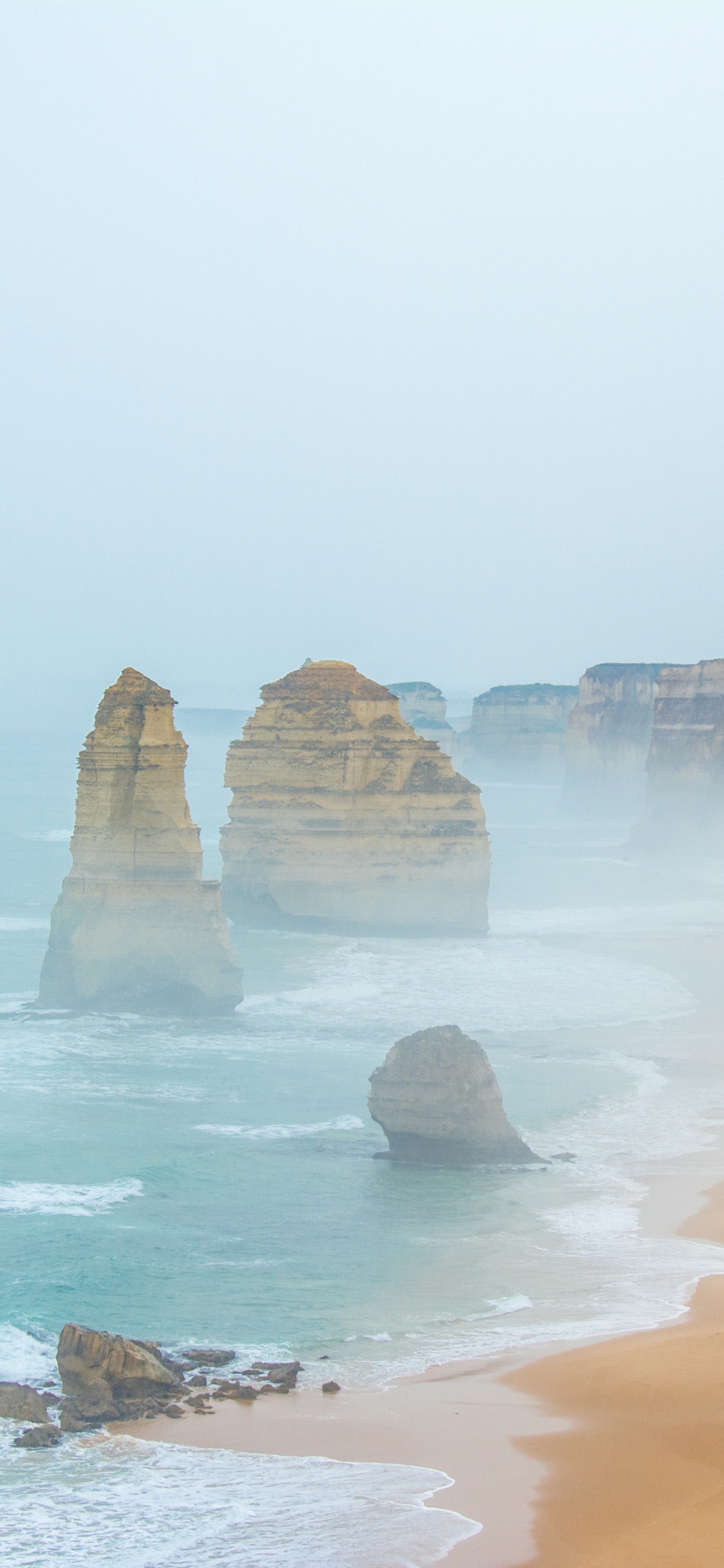 Brown Rock Formation on Seashore During Daytime. Wallpaper in 1242x2688 Resolution