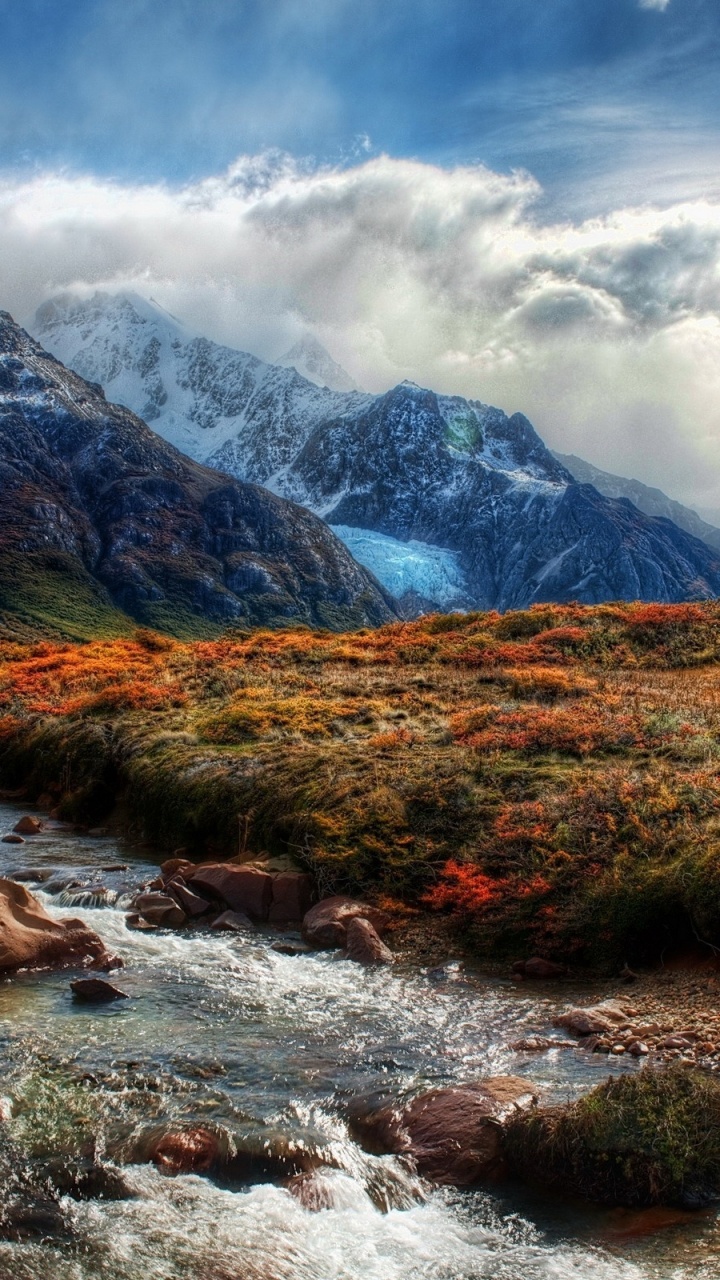 Green Grass Field Near Mountain Under White Clouds During Daytime. Wallpaper in 720x1280 Resolution