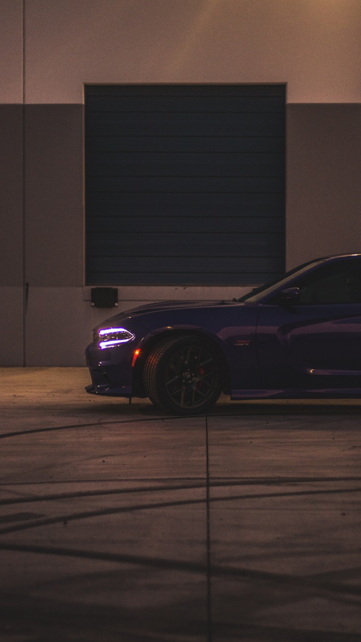 Black Porsche 911 Parked in Front of Garage. Wallpaper in 720x1280 Resolution
