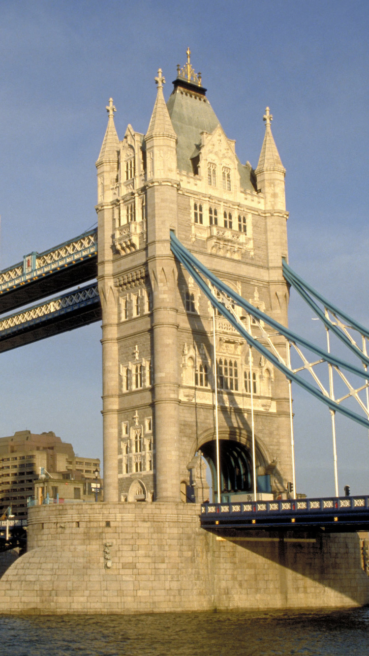 Brown Concrete Bridge Over River During Daytime. Wallpaper in 750x1334 Resolution