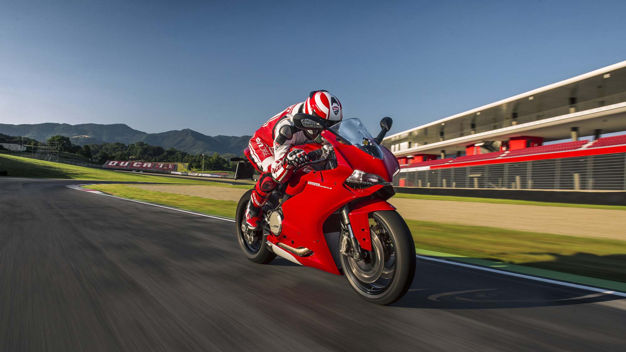 Man in Red Motorcycle Helmet Riding on Red Sports Bike on Road During Daytime. Wallpaper in 1280x720 Resolution