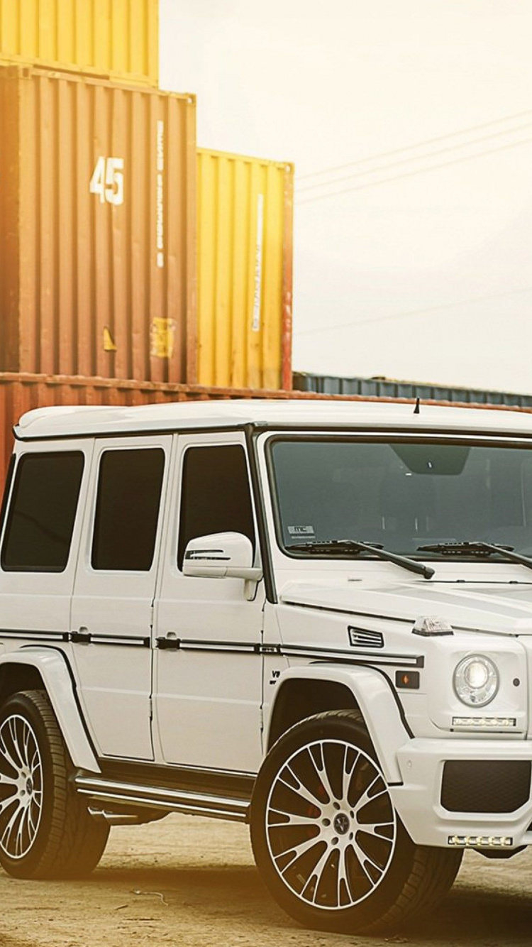 White Jeep Wrangler Parked on Gray Asphalt Road During Daytime. Wallpaper in 750x1334 Resolution