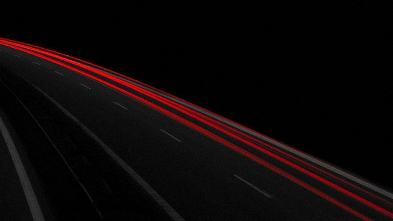 Schwarzes Auto Auf Der Straße Während Der Nachtzeit. Wallpaper in 1366x768 Resolution