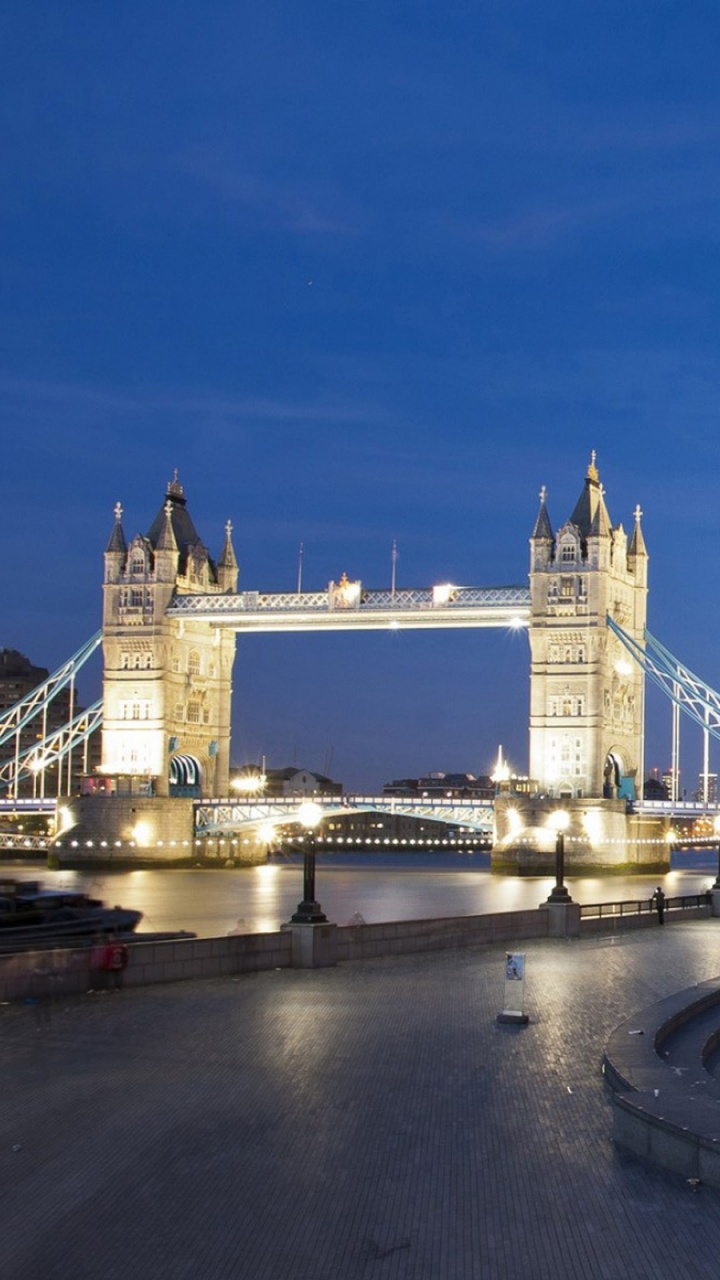 White and Blue Building Near Body of Water During Night Time. Wallpaper in 720x1280 Resolution