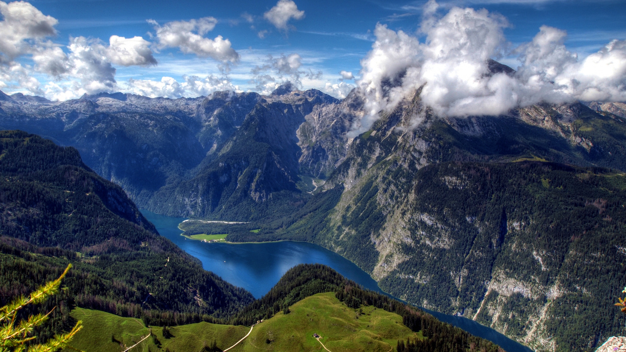 Green and Black Mountains Under Blue Sky and White Clouds During Daytime. Wallpaper in 1280x720 Resolution