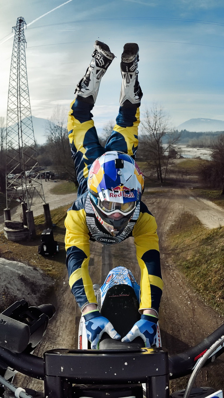 Man in Blue and Yellow Jacket Riding on Black and Blue Stroller During Daytime. Wallpaper in 750x1334 Resolution