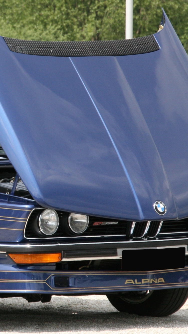 Blue Car on Gray Asphalt Road During Daytime. Wallpaper in 750x1334 Resolution