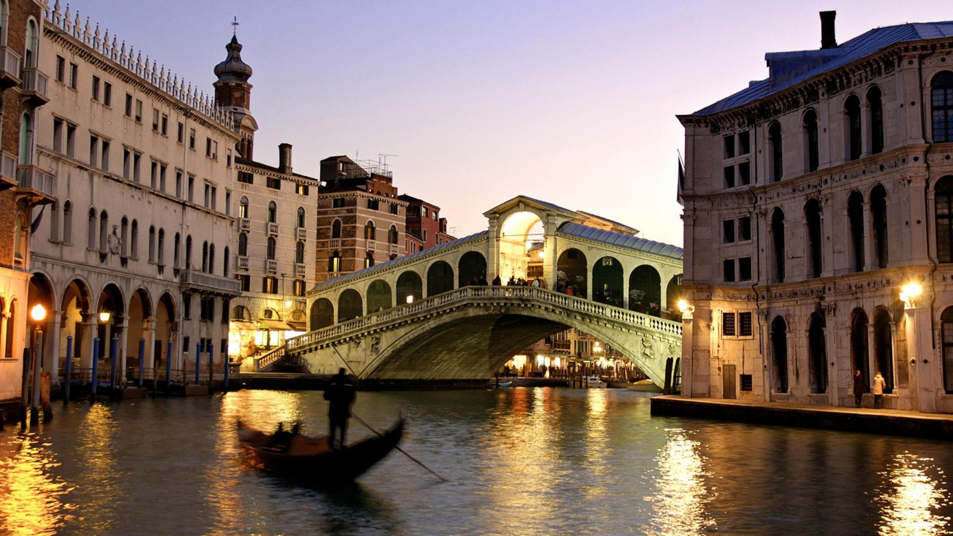 White and Brown Concrete Building Near Body of Water During Daytime. Wallpaper in 1920x1080 Resolution
