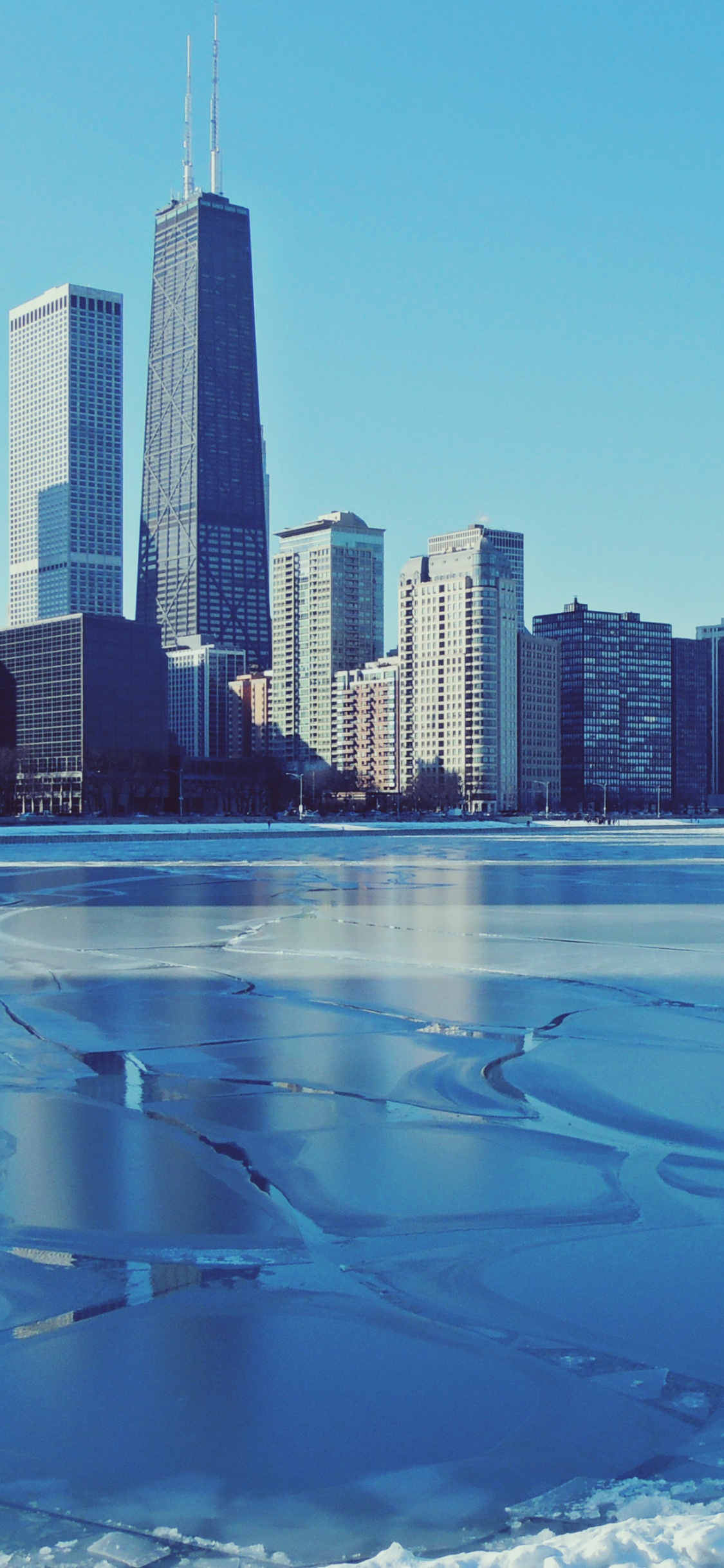 City Skyline Under Blue Sky During Daytime. Wallpaper in 1125x2436 Resolution