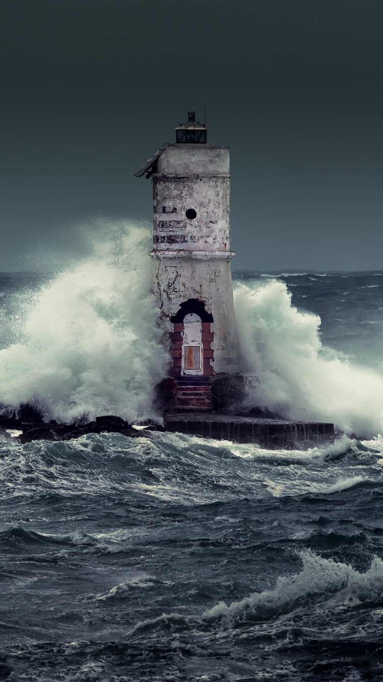 Brown and White Concrete Building on Sea Waves During Daytime. Wallpaper in 750x1334 Resolution