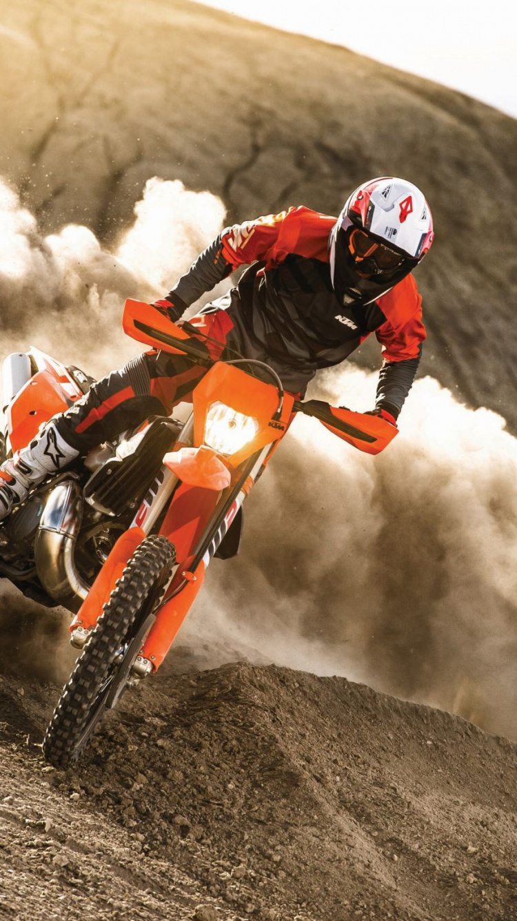 Mann im Orangen Und Schwarzen Motocross-Anzug, Der Motocross-Dirt-Bike Fährt Riding. Wallpaper in 750x1334 Resolution