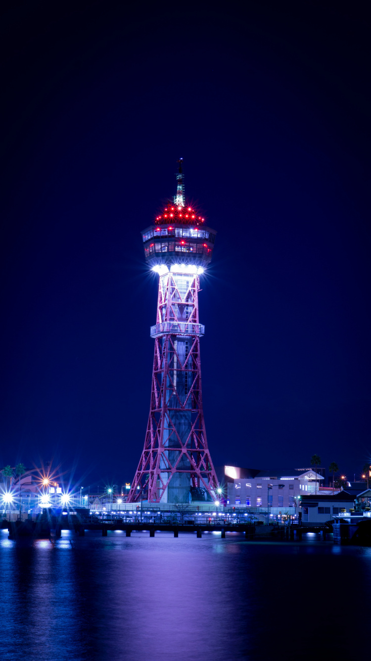 Torre Roja y Blanca Durante la Noche. Wallpaper in 750x1334 Resolution