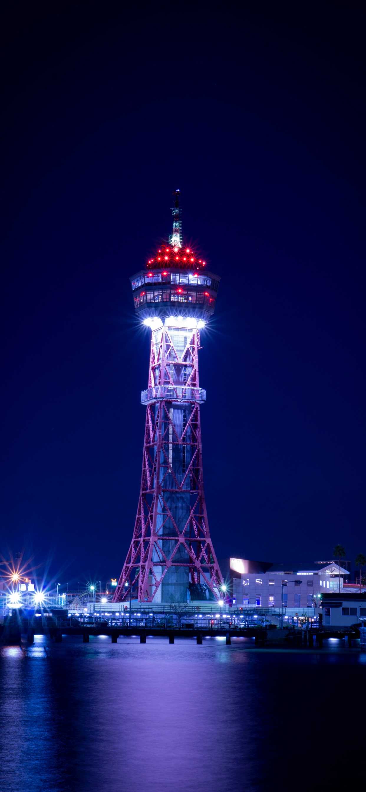 Red and White Tower During Night Time. Wallpaper in 1242x2688 Resolution