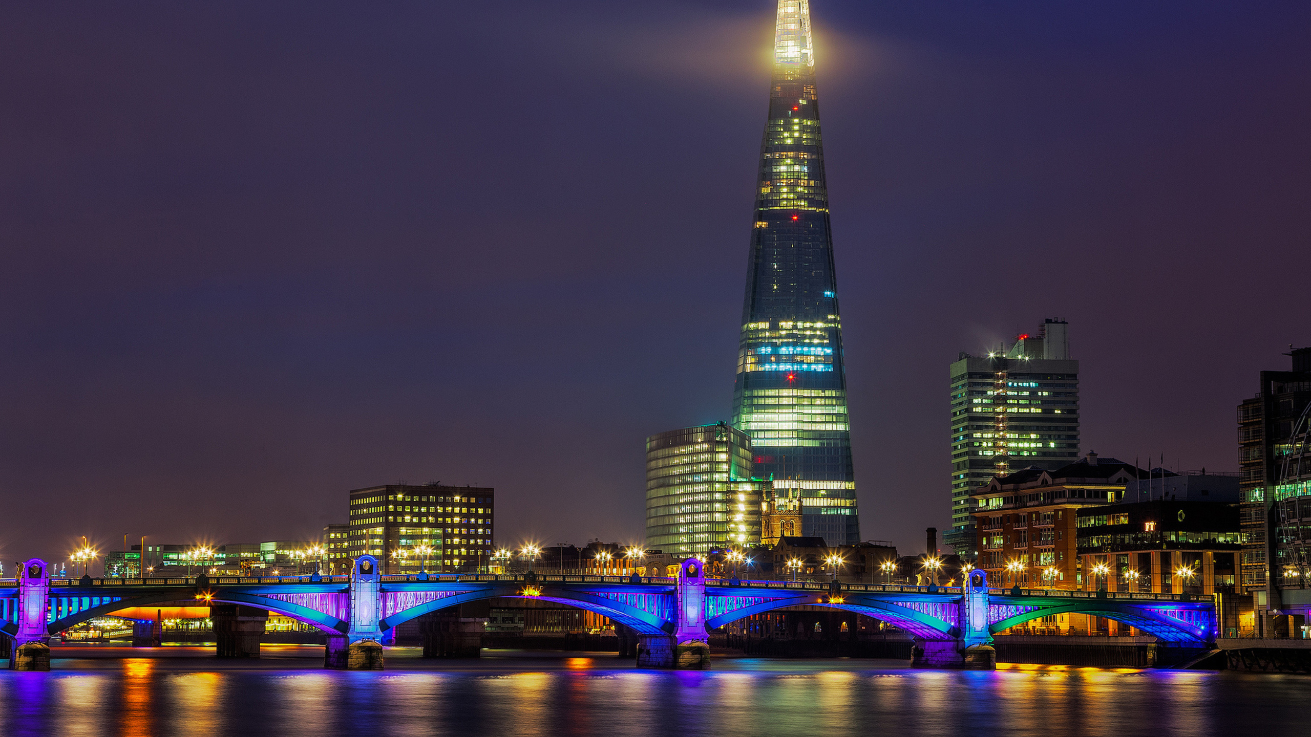Lighted City Buildings During Night Time. Wallpaper in 2560x1440 Resolution
