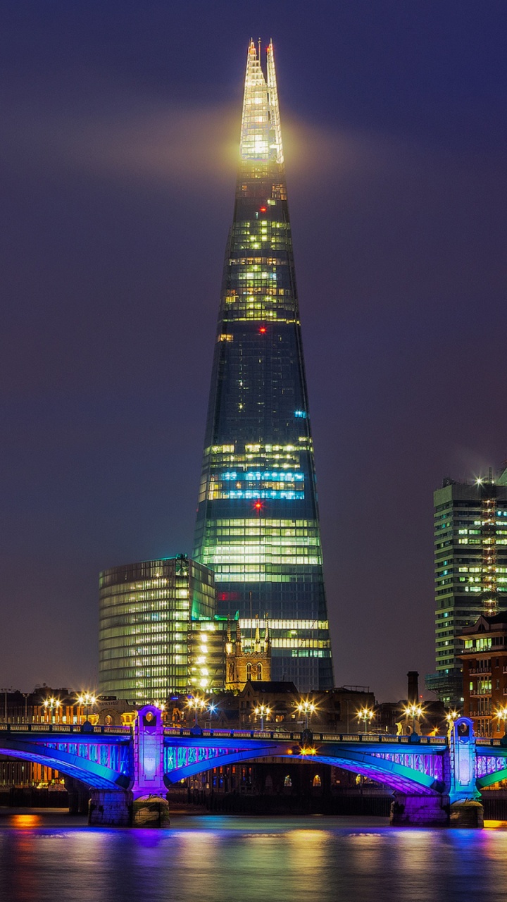 Lighted City Buildings During Night Time. Wallpaper in 720x1280 Resolution