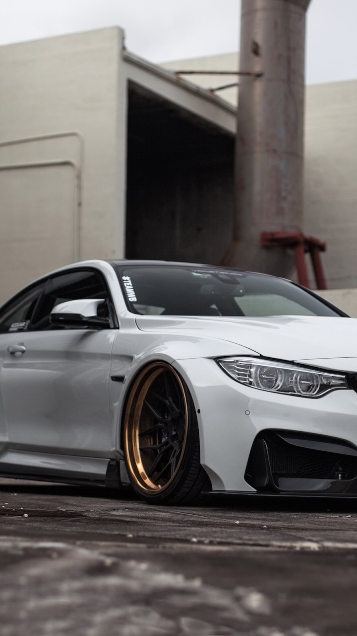 Silver Bmw m 3 Coupe Parked Near White Building. Wallpaper in 720x1280 Resolution