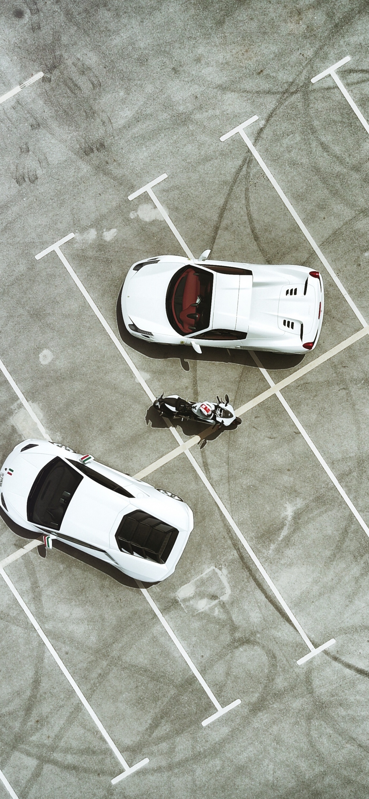 White Car on Gray Concrete Floor. Wallpaper in 1242x2688 Resolution