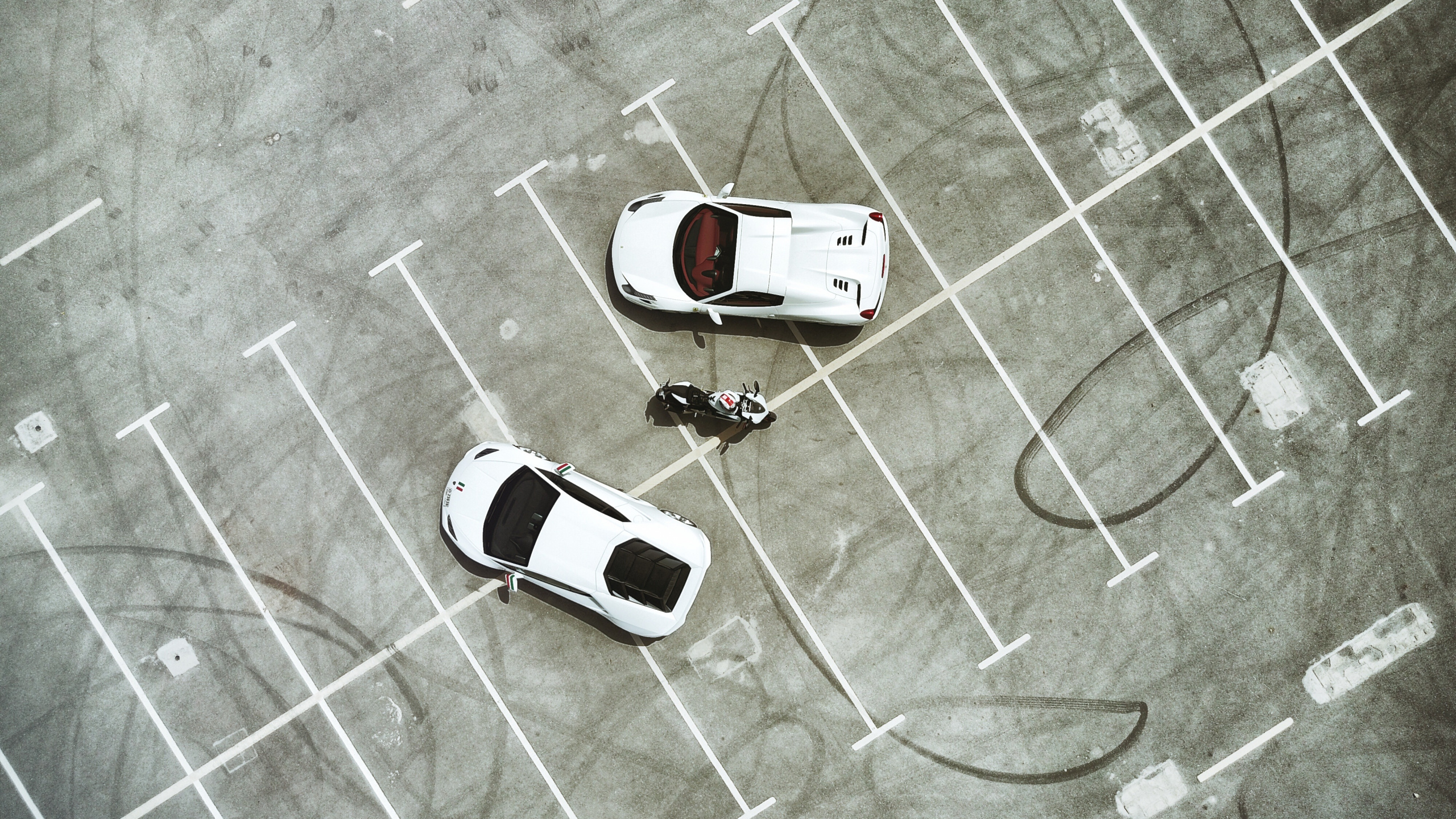 White Car on Gray Concrete Floor. Wallpaper in 2560x1440 Resolution