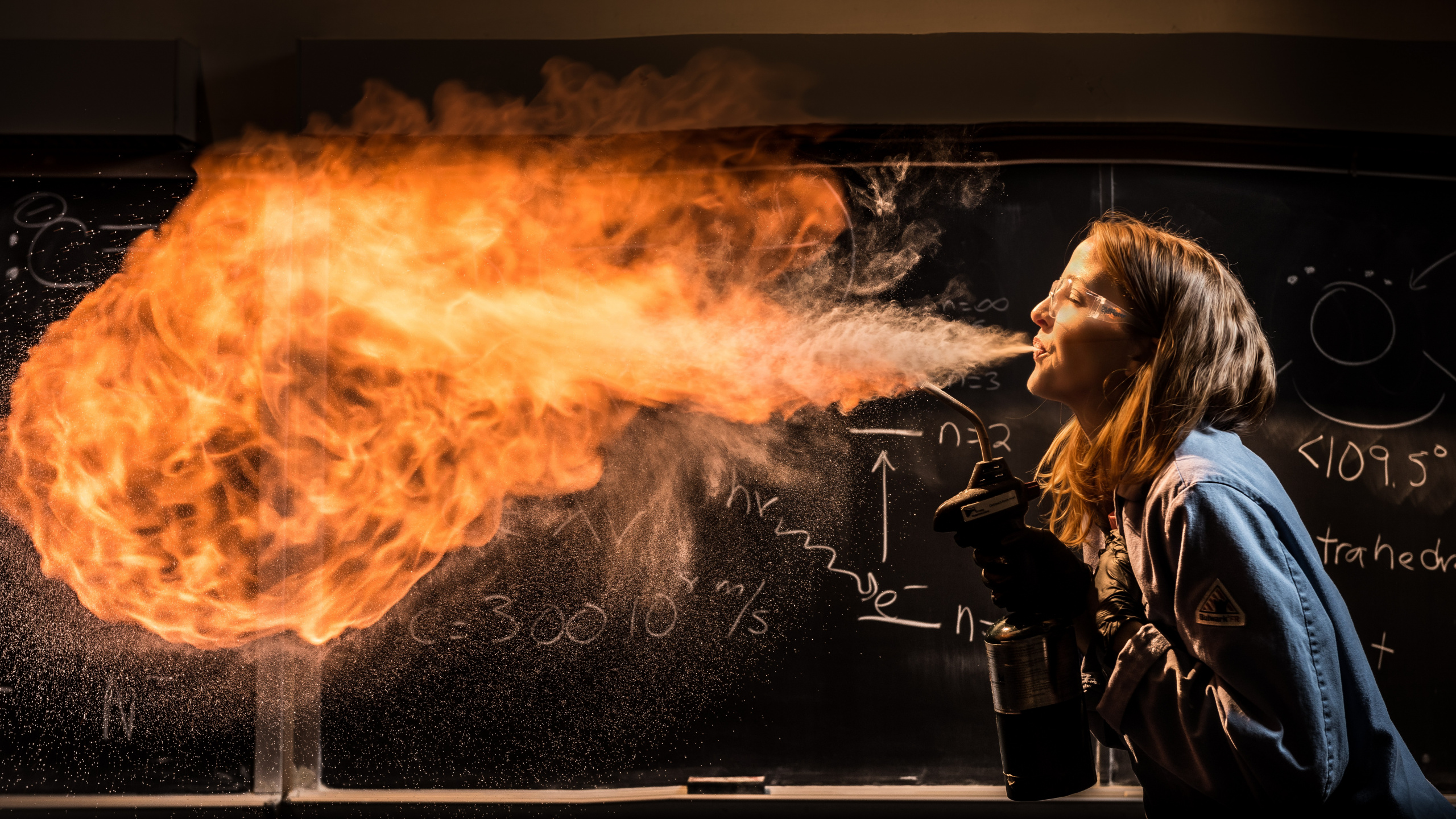 Woman in Black Leather Jacket Smoking. Wallpaper in 2560x1440 Resolution