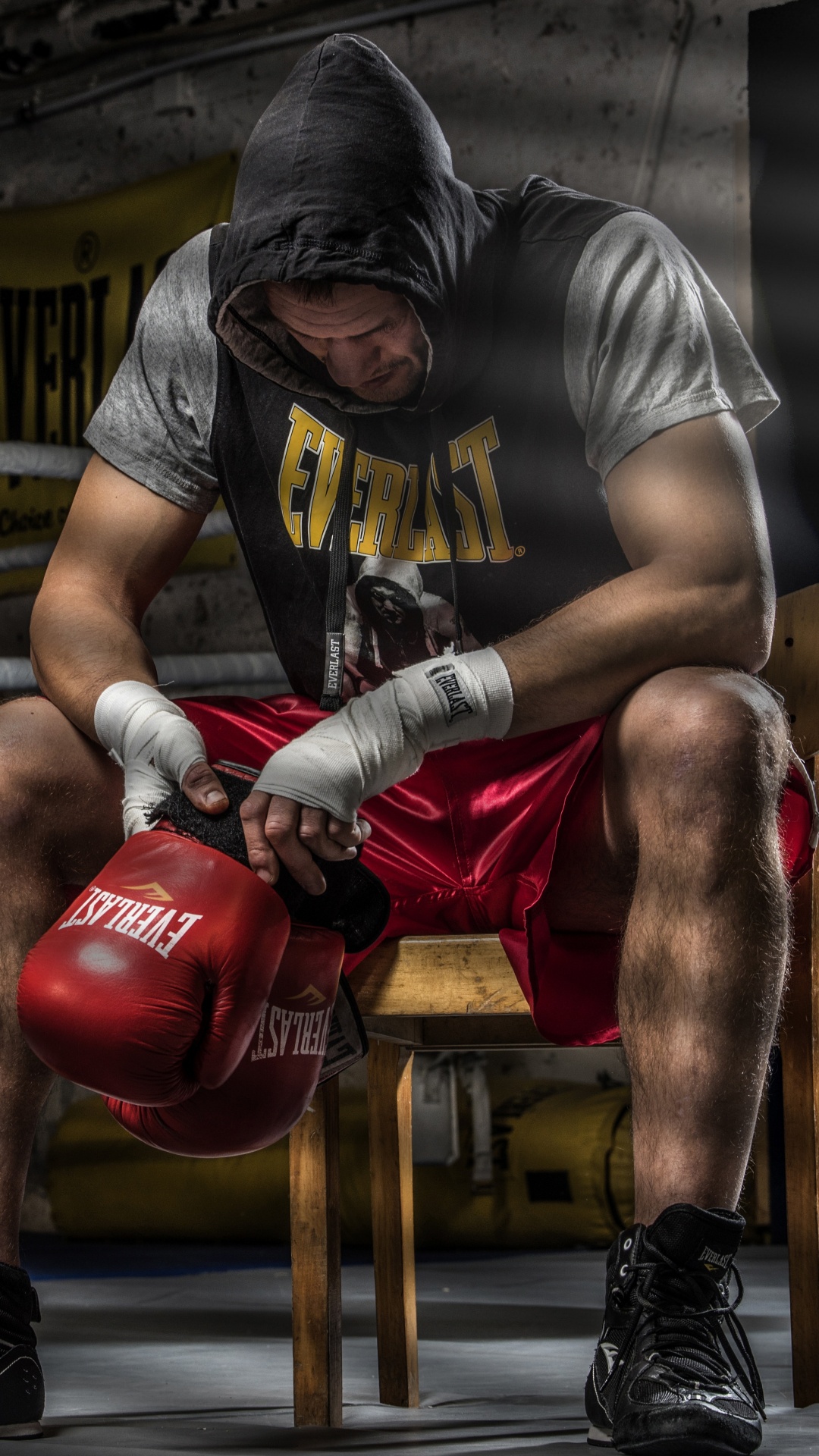Man in Gray T-shirt and Red Boxing Gloves Doing Push Up. Wallpaper in 1080x1920 Resolution