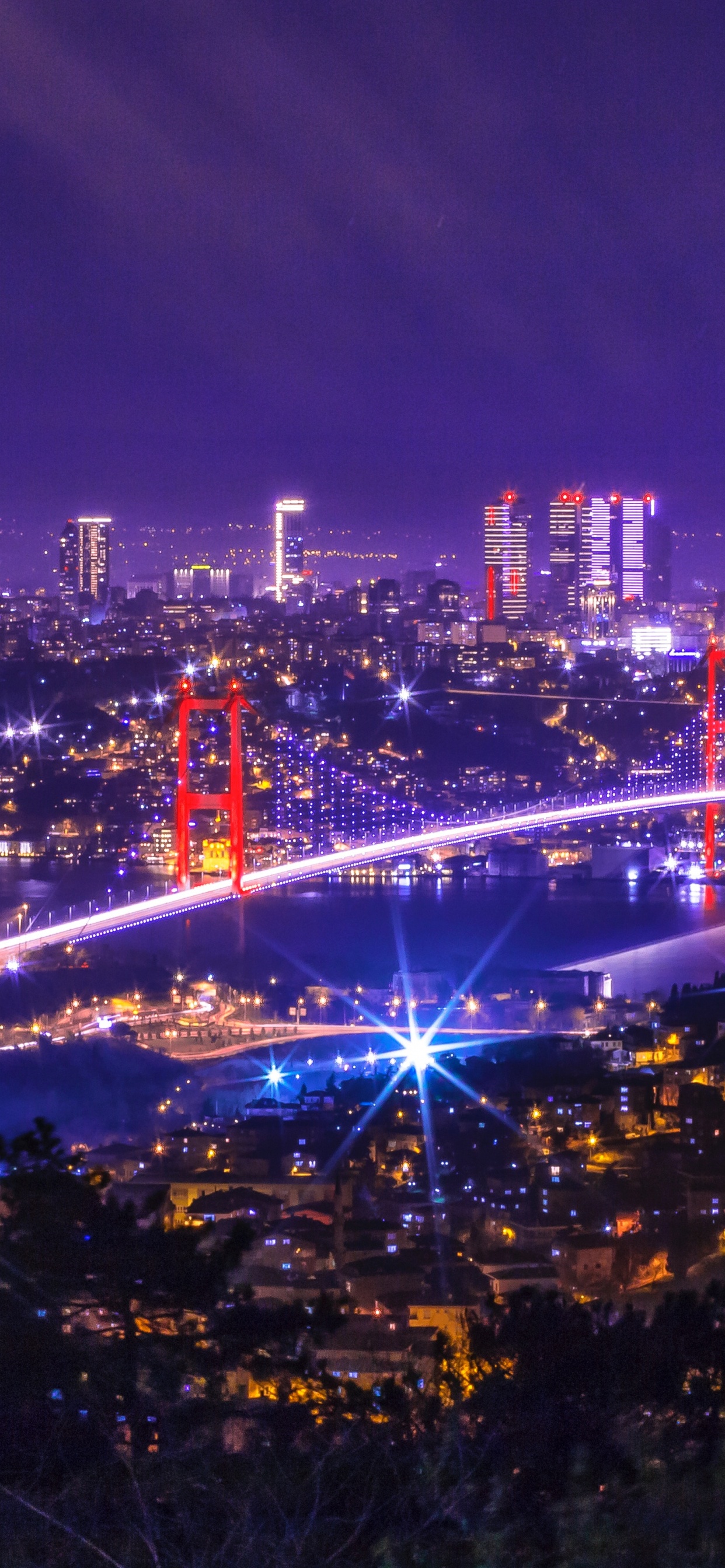 Ville Avec Des Immeubles de Grande Hauteur Pendant la Nuit. Wallpaper in 1242x2688 Resolution