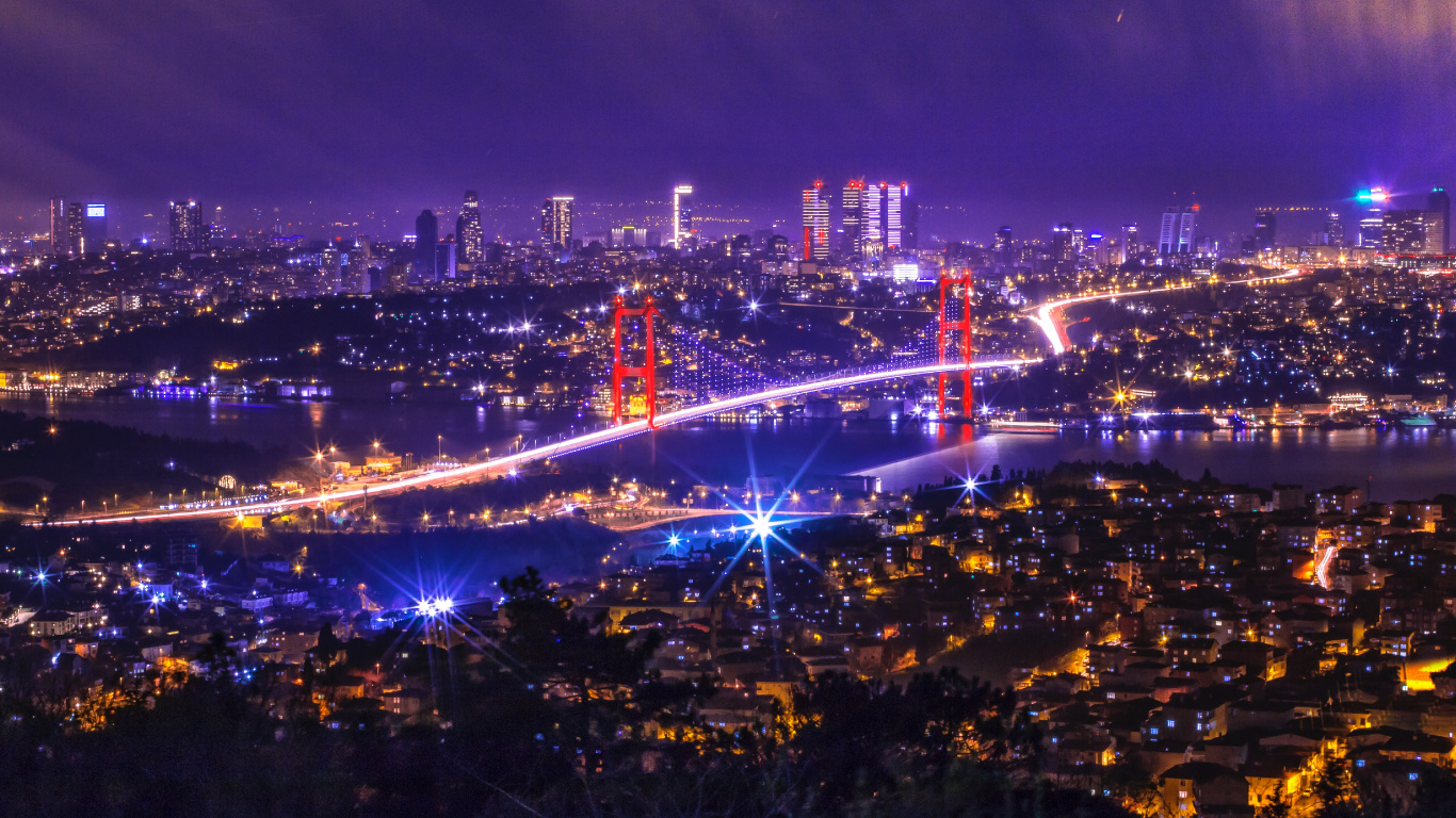 Ville Avec Des Immeubles de Grande Hauteur Pendant la Nuit. Wallpaper in 1366x768 Resolution