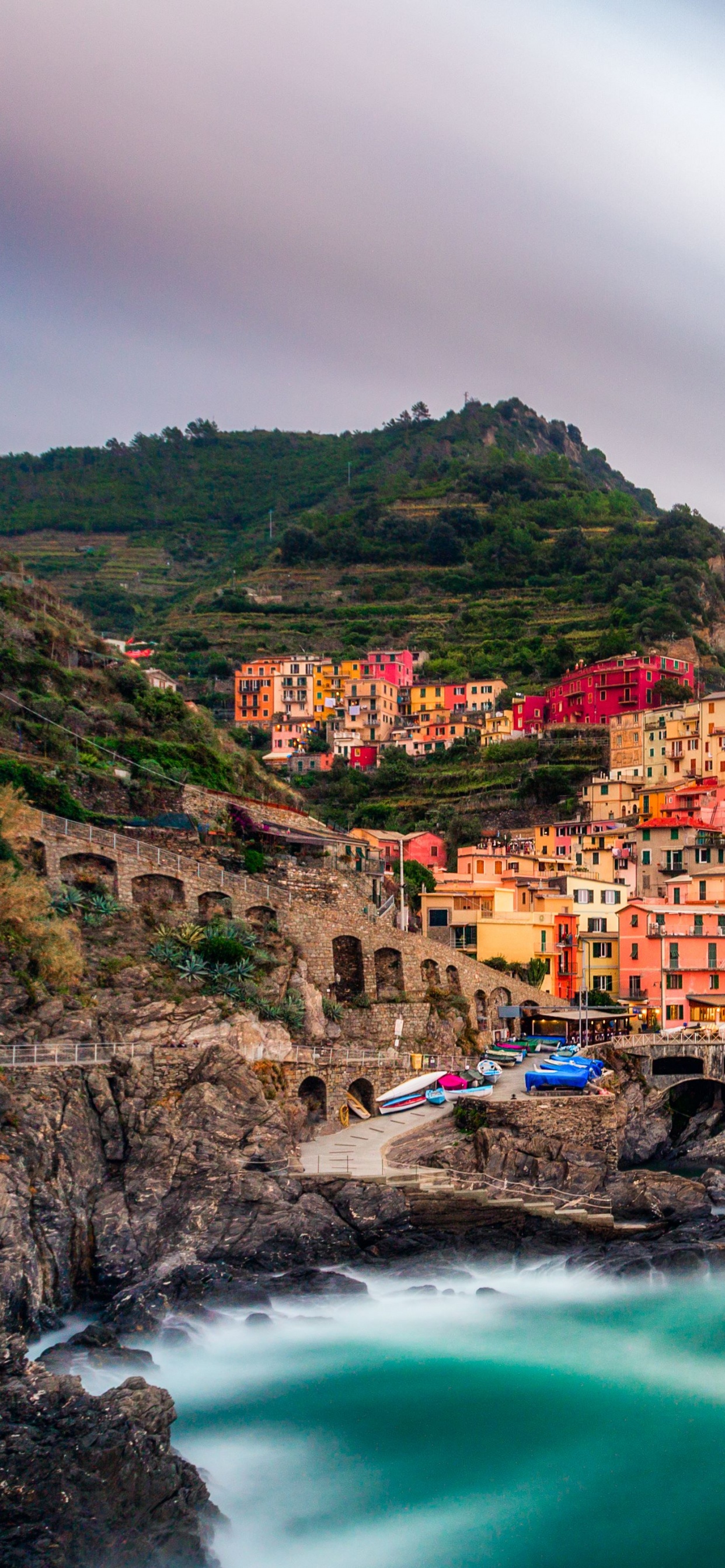 Houses on Mountain Near Body of Water During Daytime. Wallpaper in 1242x2688 Resolution