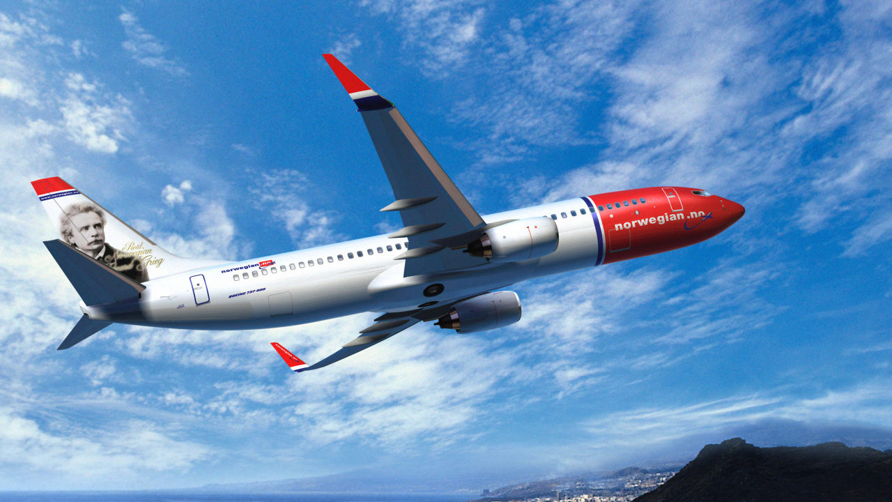 Weißes Und Rotes Flugzeug, Das Tagsüber Unter Blauem Himmel Fliegt. Wallpaper in 1280x720 Resolution