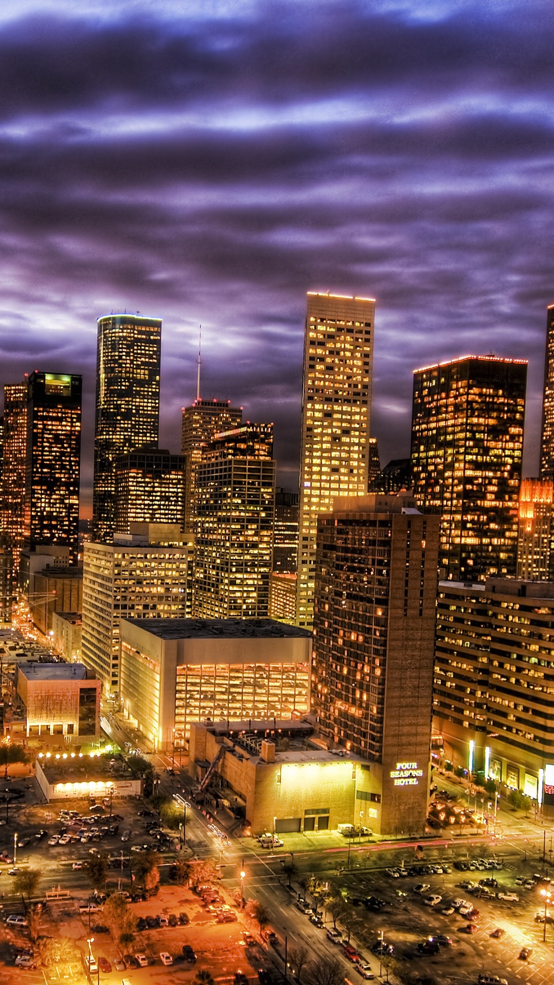 City Skyline Under Gray Clouds During Night Time. Wallpaper in 1080x1920 Resolution