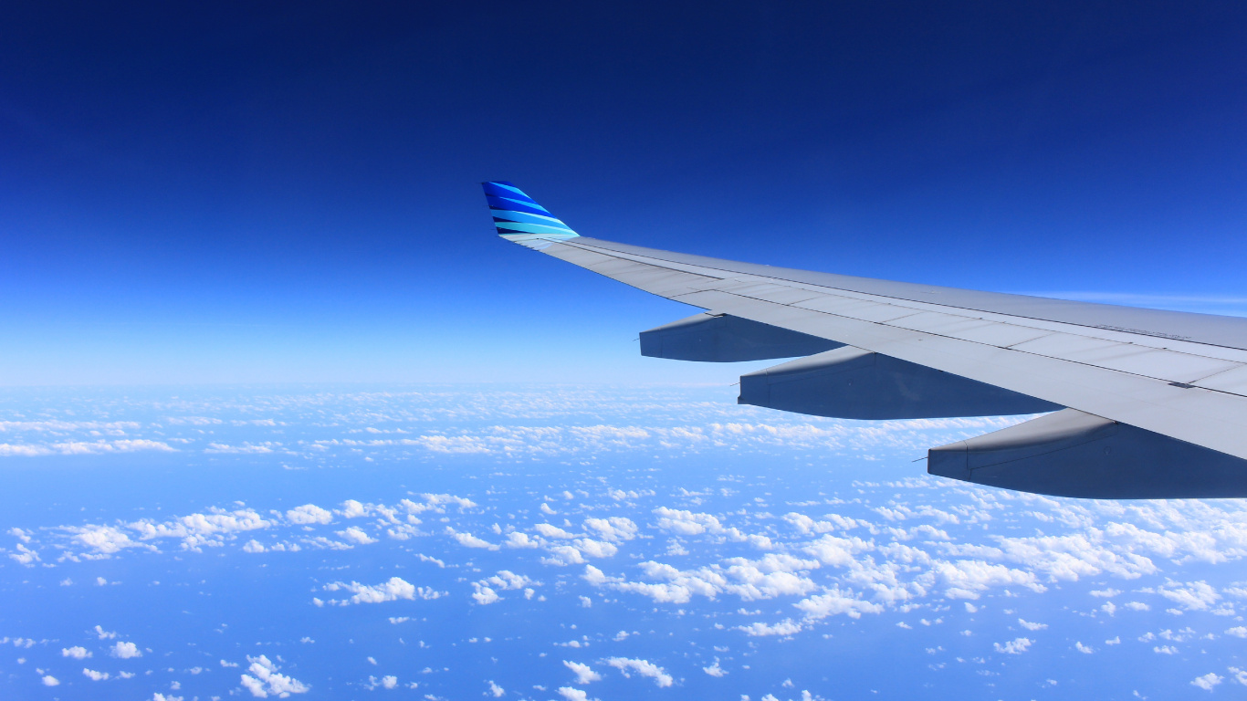 White and Blue Airplane Wing Under Blue Sky During Daytime. Wallpaper in 1366x768 Resolution