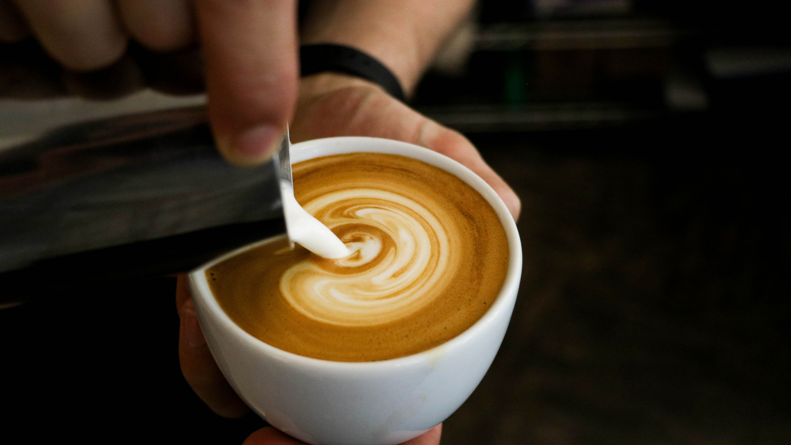 Person Holding White Ceramic Cup With Brown Liquid. Wallpaper in 2560x1440 Resolution
