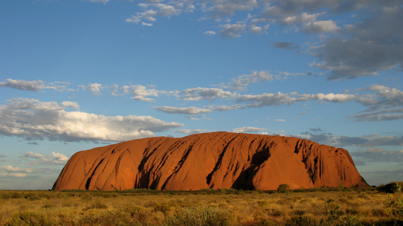 Brown Mountain Under Blue Sky During Daytime. Wallpaper in 1366x768 Resolution