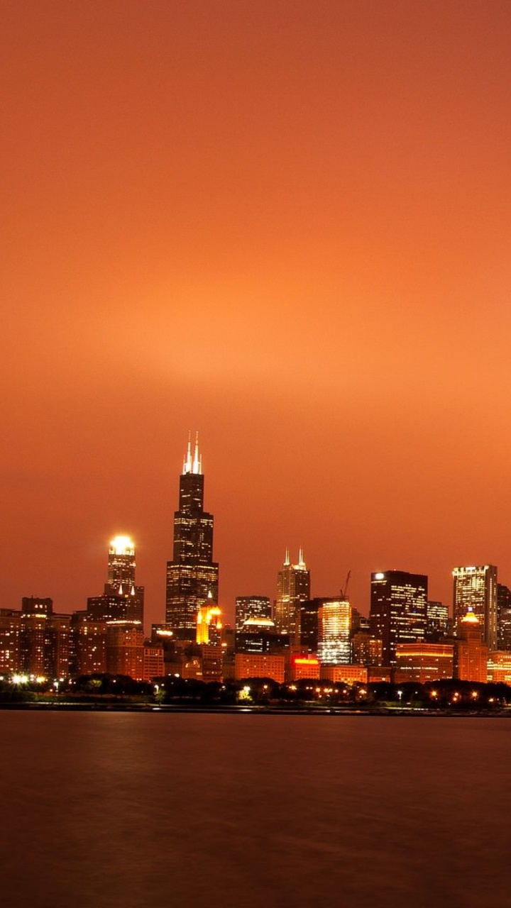 City Skyline During Night Time. Wallpaper in 720x1280 Resolution