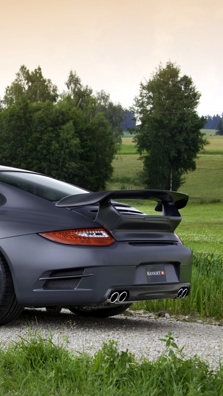 Black Porsche 911 on Green Grass Field During Daytime. Wallpaper in 750x1334 Resolution