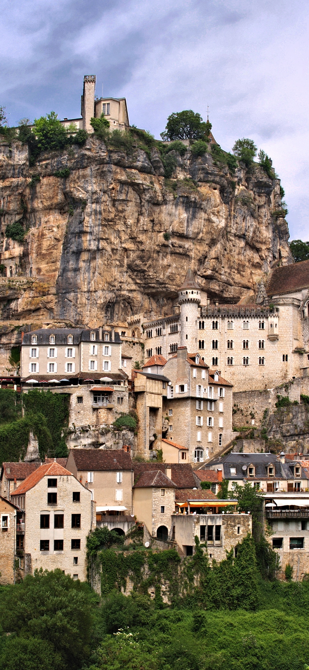 Brown Concrete Building on Top of Mountain During Daytime. Wallpaper in 1242x2688 Resolution