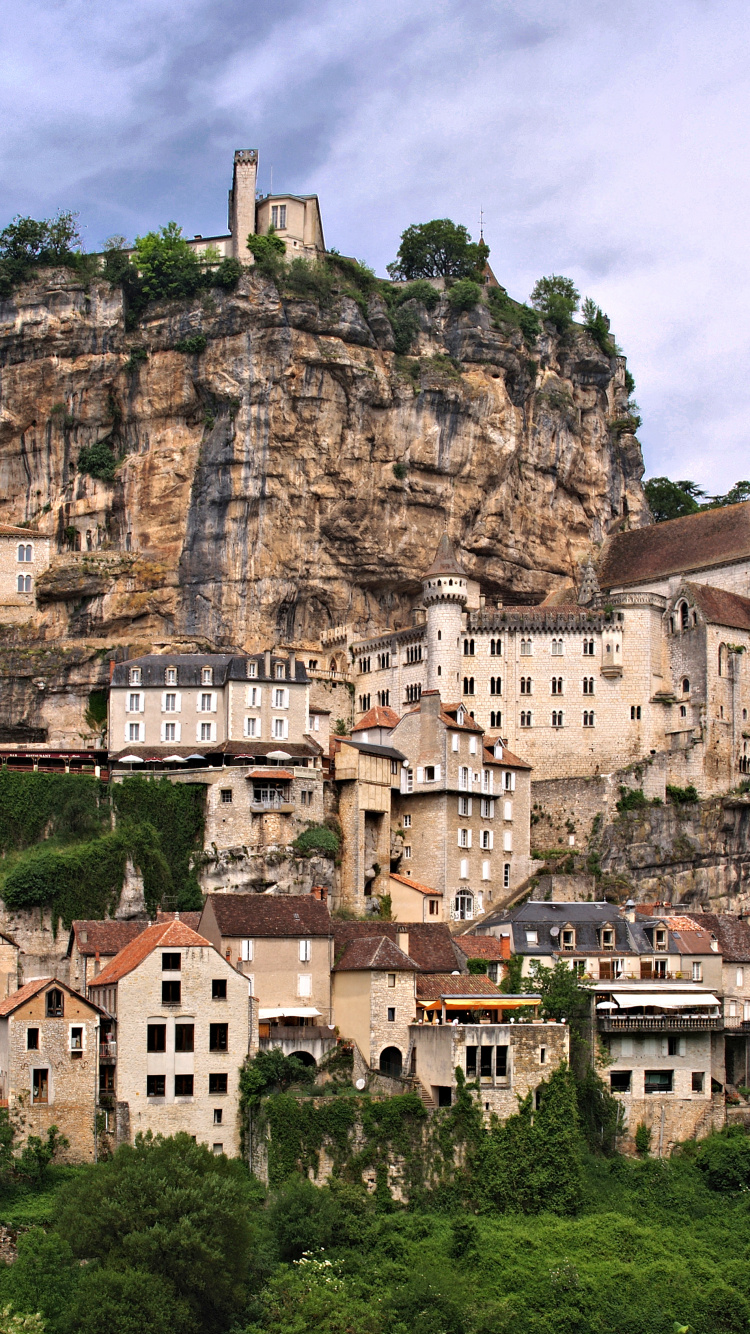 Brown Concrete Building on Top of Mountain During Daytime. Wallpaper in 750x1334 Resolution
